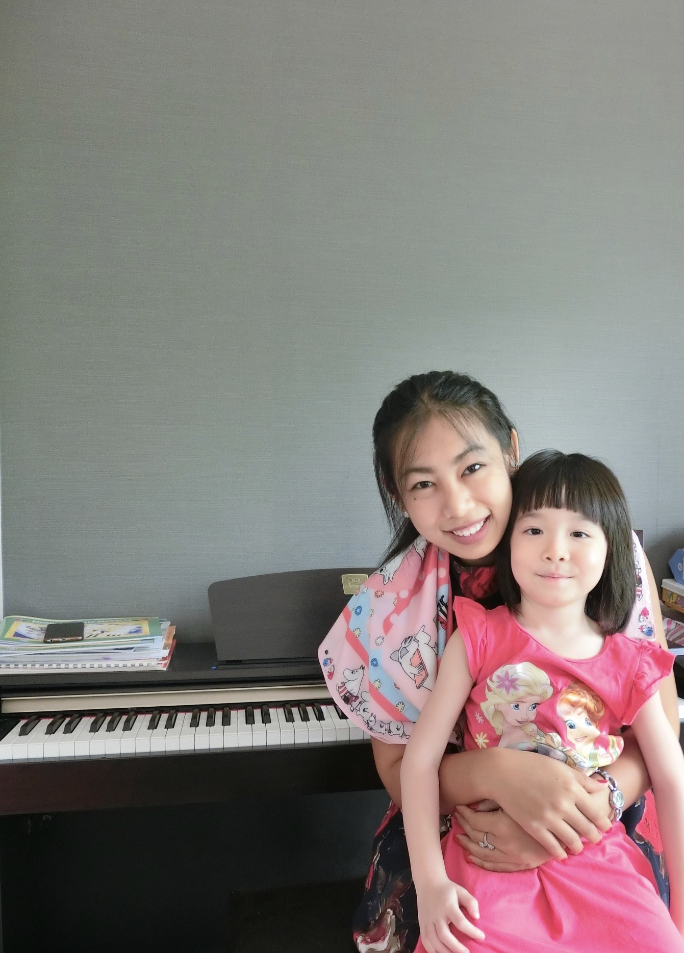 Minnie seated at a grand piano