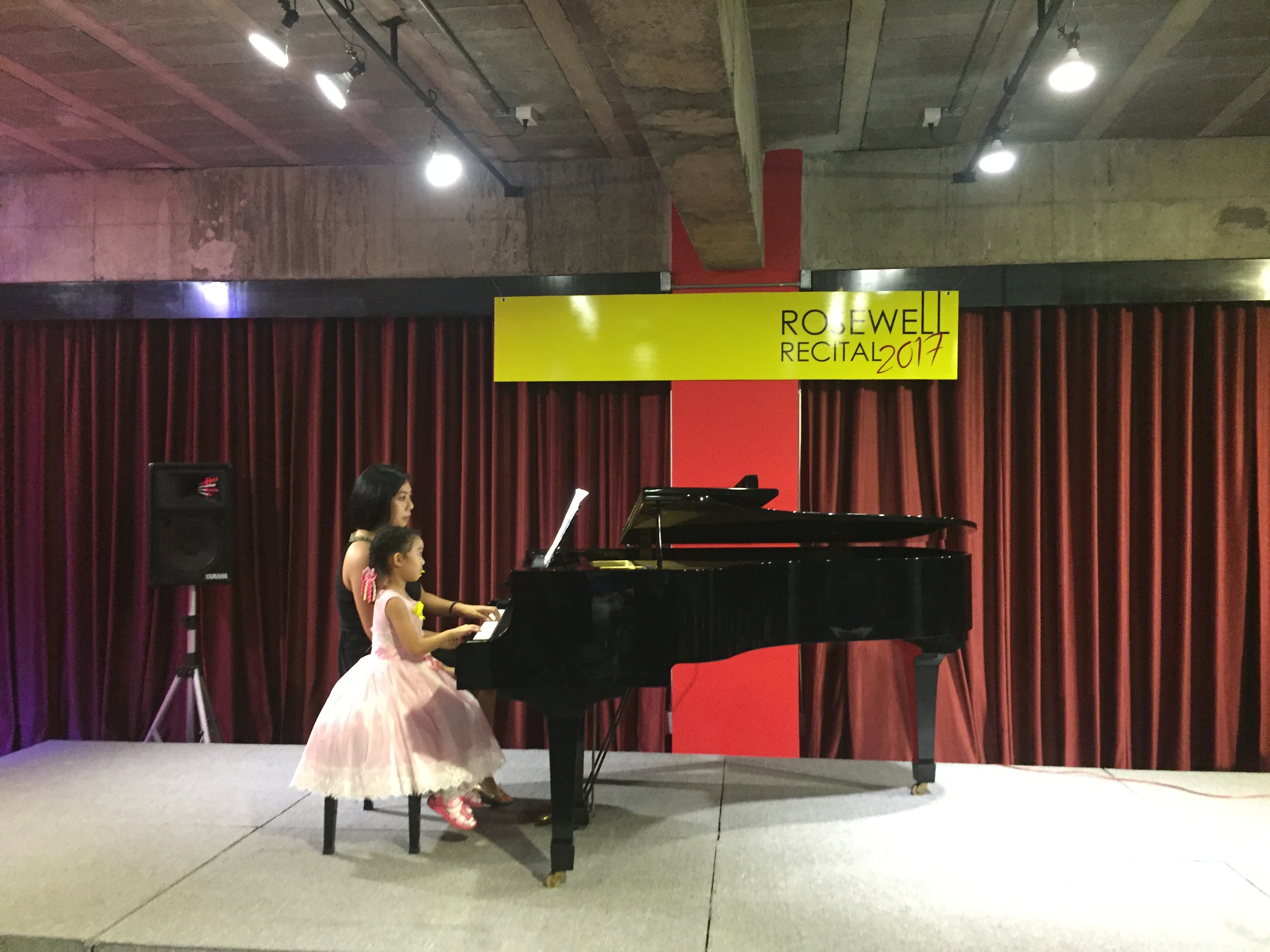 Minnie with a young student at a piano lesson